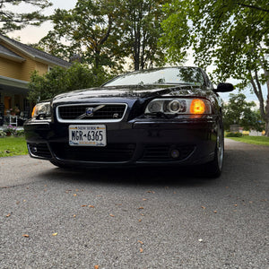 Tri-color LED fog lights installed in a Volvo V70R with lights off