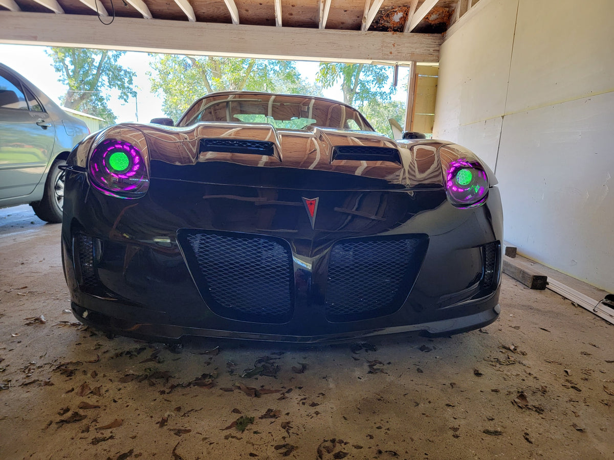 Black Pontiac Solstice with Purple halo headlights